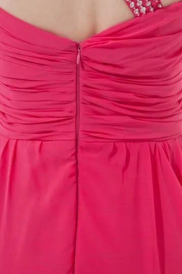 Robe fuchsia asymétrique ornée de strass courte devant longue derrière