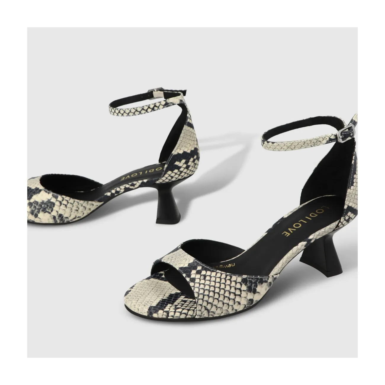 Sandale pour femme en cuir animal print blanc et noir. I LODI Chaussures pour femme online.